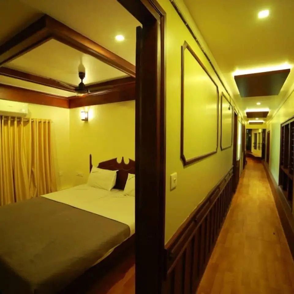 Bedroom doorway opening onto the corridor of a six-bedroom houseboat