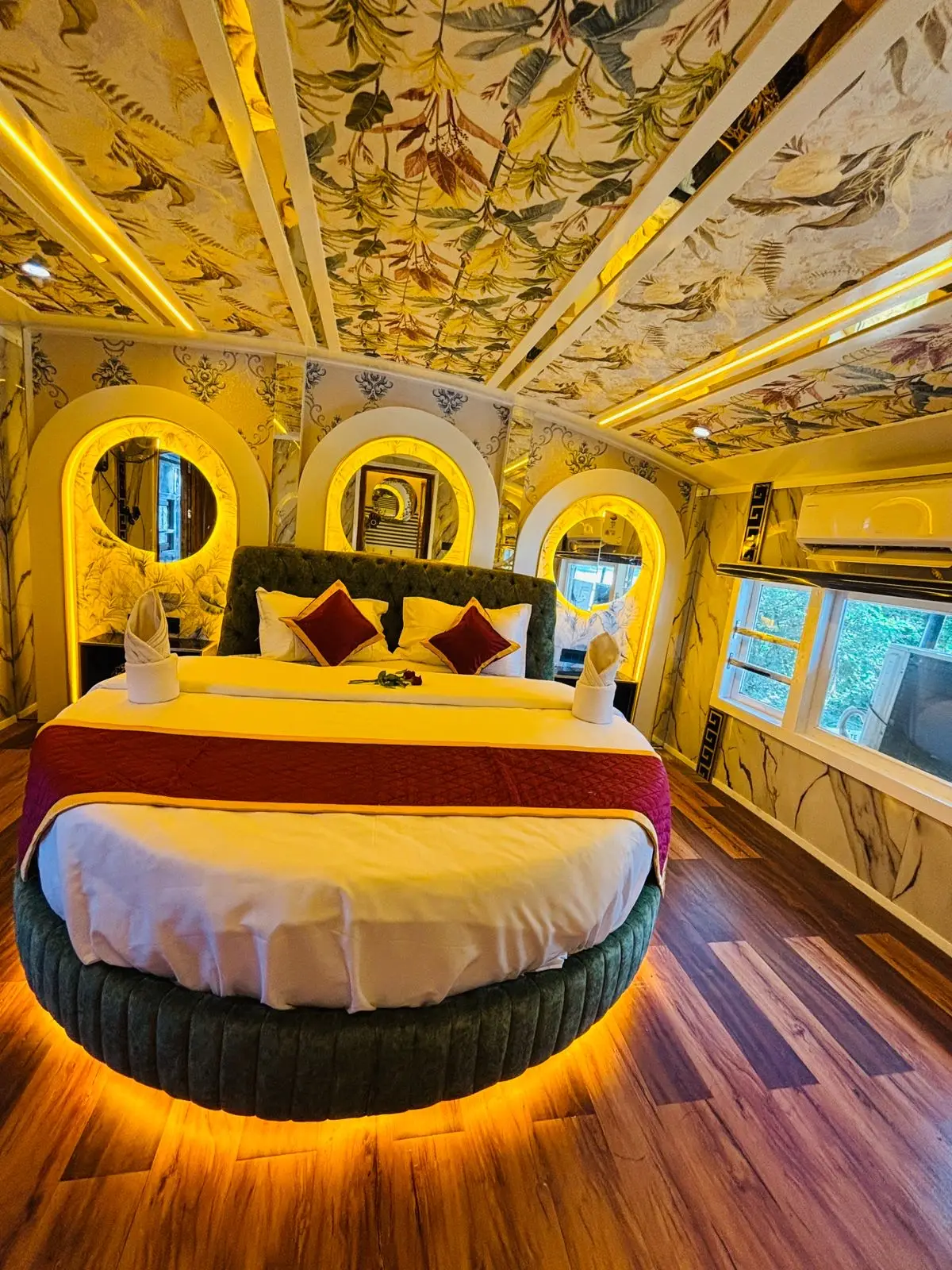 Second round-bed suite with marble panelling on a five-bedroom Kerala houseboat
