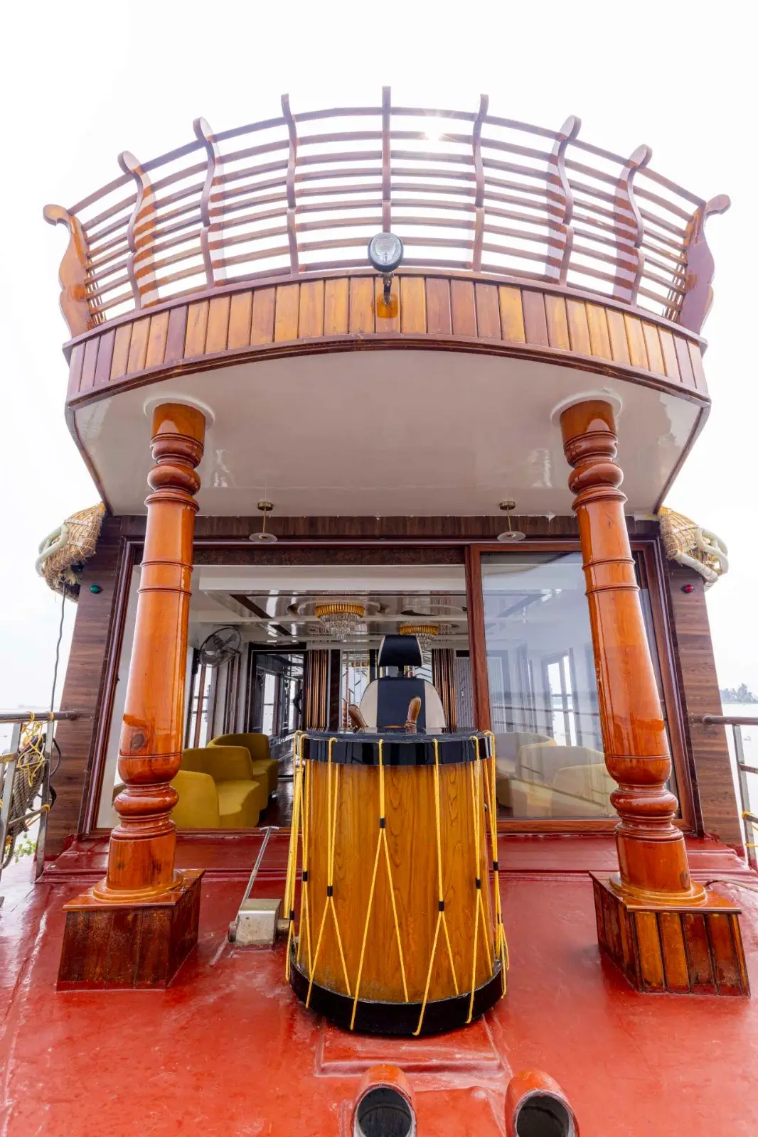 Bow and upper deck of a two-bedroom Alleppey houseboat seen from the water