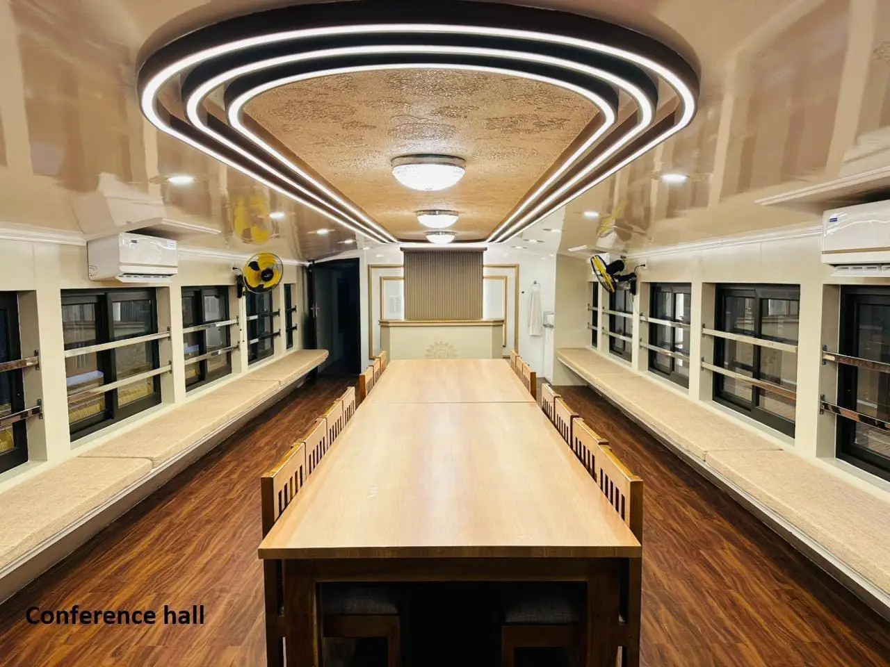 Wide view of the onboard conference hall seating sixteen on a Kerala houseboat