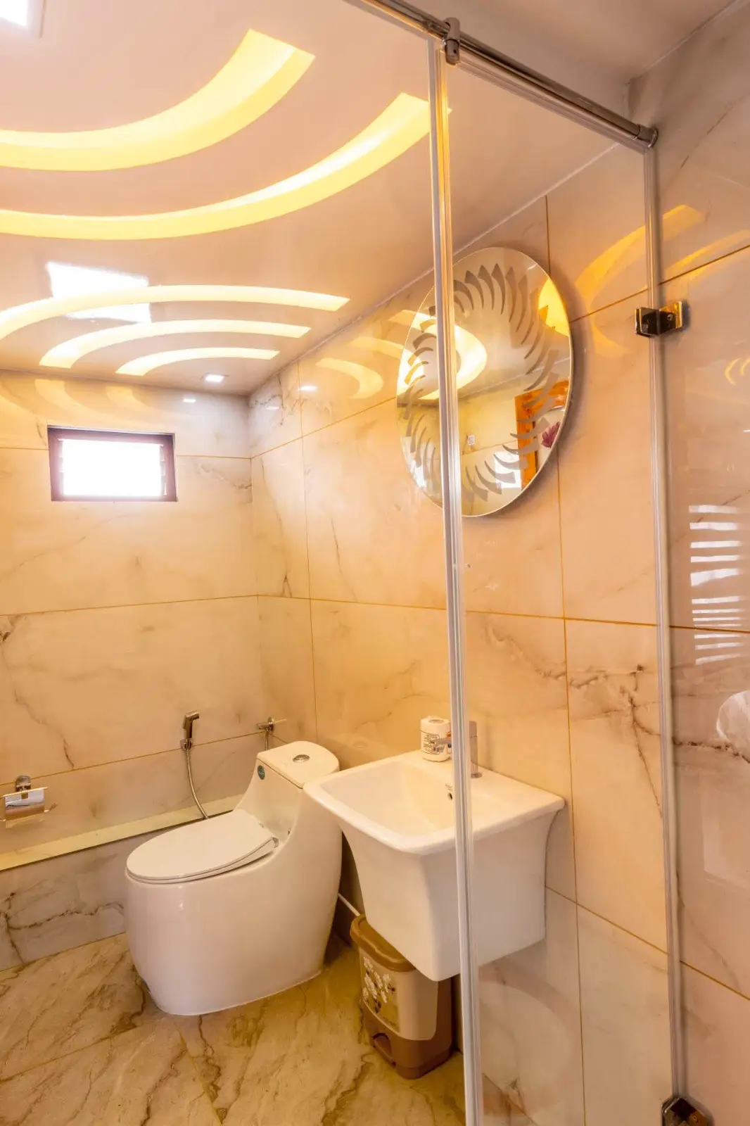 Marble en-suite bathroom with backlit ceiling on a premium houseboat