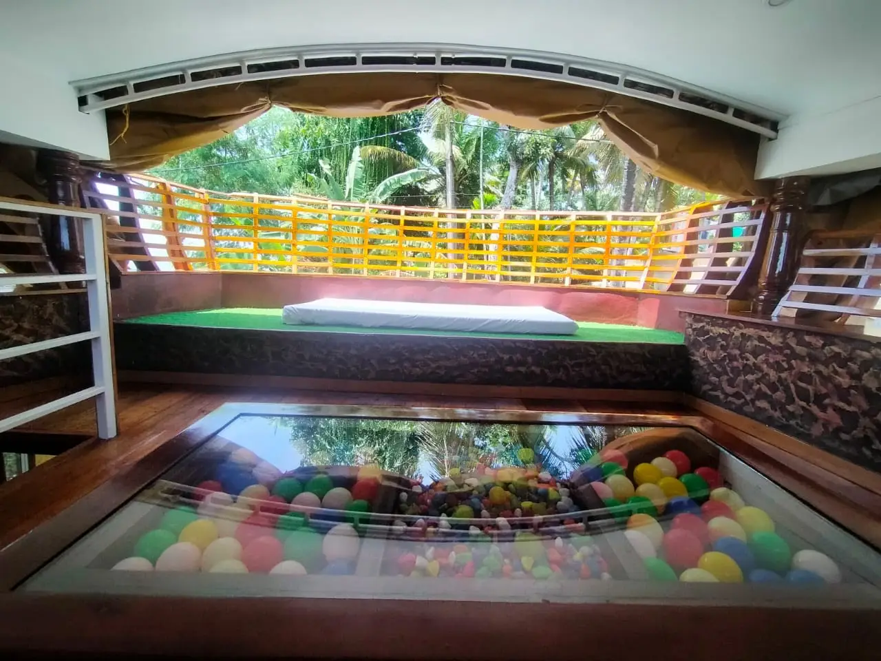Children's ball pool play area on the sundeck of a family-friendly Alleppey houseboat
