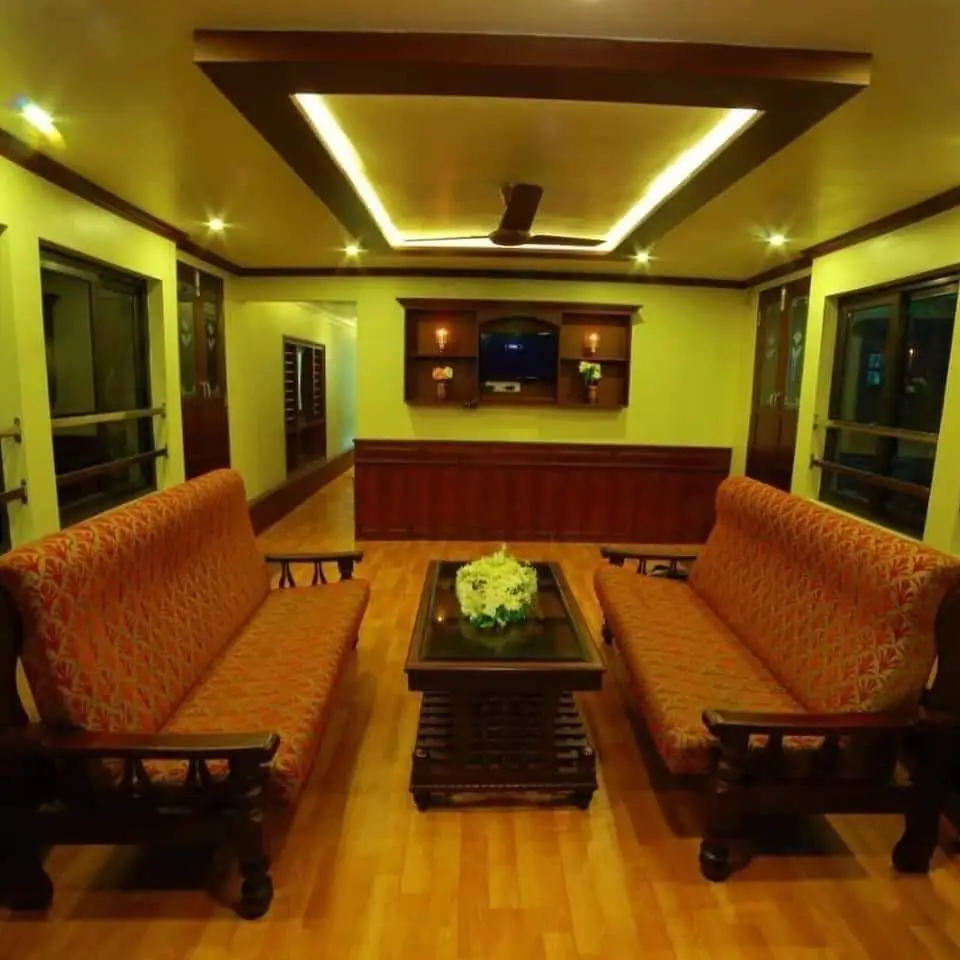 Sofa lounge with television and coffee table on a premium Alleppey houseboat