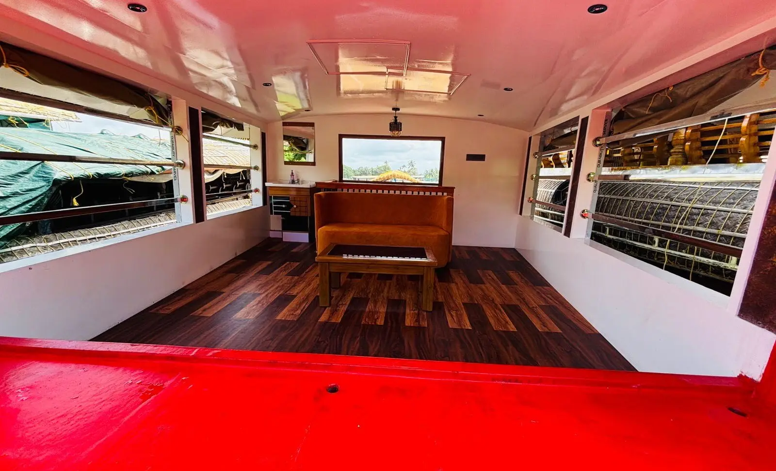Open stern deck with bench seating on a 1-bedroom Alleppey houseboat