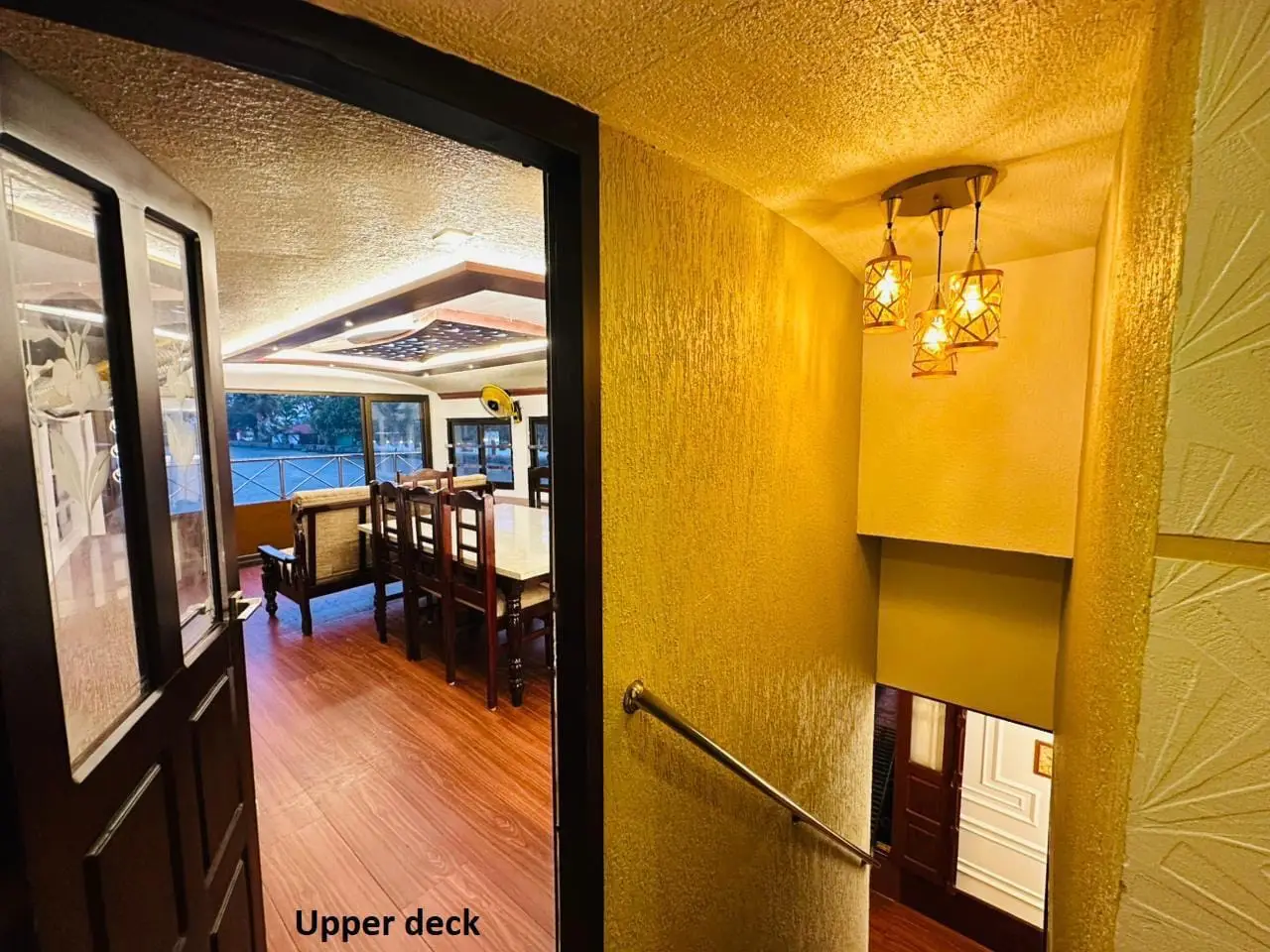 Entrance to the upper deck dining area of an Alleppey houseboat