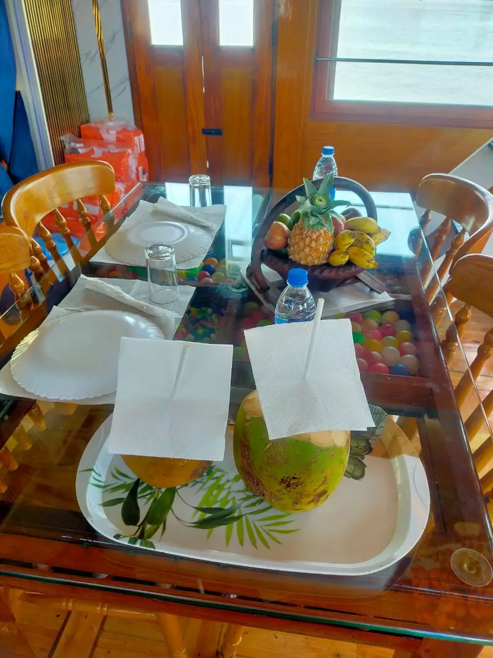 Tender coconut and fresh fruit welcome drink served on board an Alleppey houseboat